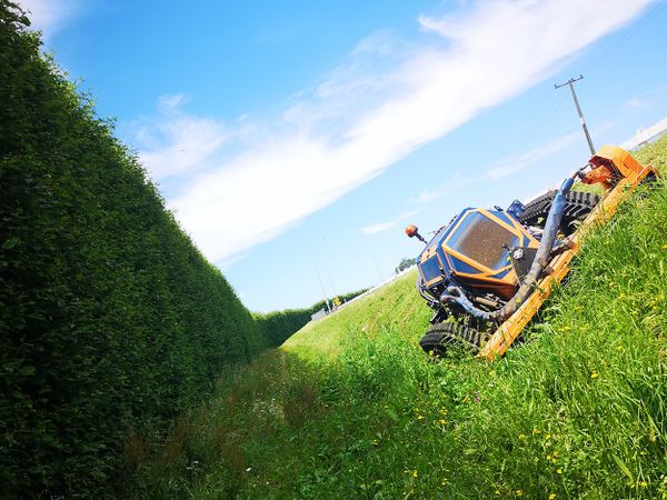 How to safely mow steep slopes